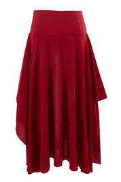 Product shot of The Flowy Skirt in colour Apple (Red), from the back