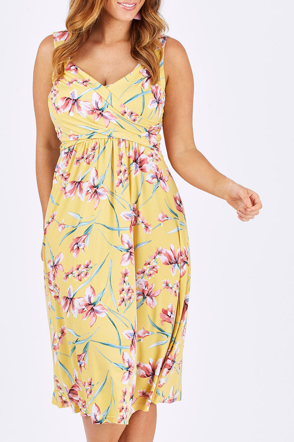 Model Laura wearing size 12 of The Diamond Neckline Dress in colour Tropical, from the front, cropped image