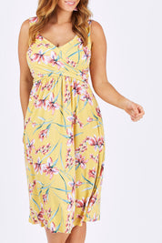 Model Laura wearing size 12 of The Diamond Neckline Dress in colour Tropical, from the front, cropped image