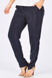 Model Laura wearing size 14 of The Curve Hem Pant in colour Ink (Blue), from the front, cropped image