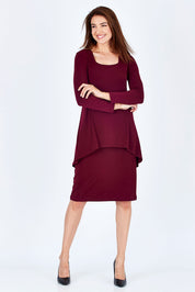 Model Rebecca wearing size 10 of The Long Rita Dress in colour Port (Purple), from the front, showing the whole outfit