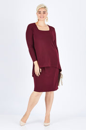 Model Stefania wearing size 14 of The Long Rita Dress in colour Port (Purple), from the front, showing the whole outfit