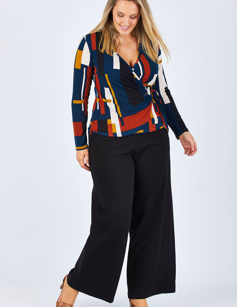 Model Jess wearing size 14 of The Wide Leg Ponte Pant in colour Black (Black), from the front, showing the whole outfit