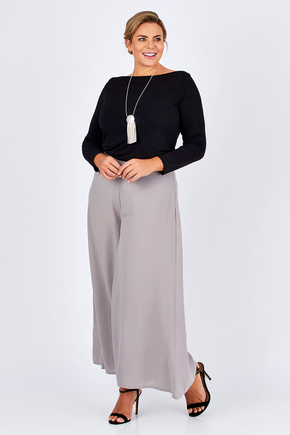 Model Fiona wearing size 16 of The Boat Neck Top in colour Black (Black), from the front, showing the whole outfit