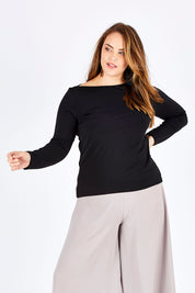 Model Sophie wearing size 14 of The Boat Neck Top in colour Black (Black), from the front, cropped image
