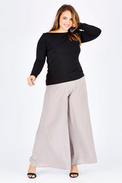 Model Sophie wearing size 14 of The Boat Neck Top in colour Black (Black), from the front, showing the whole outfit