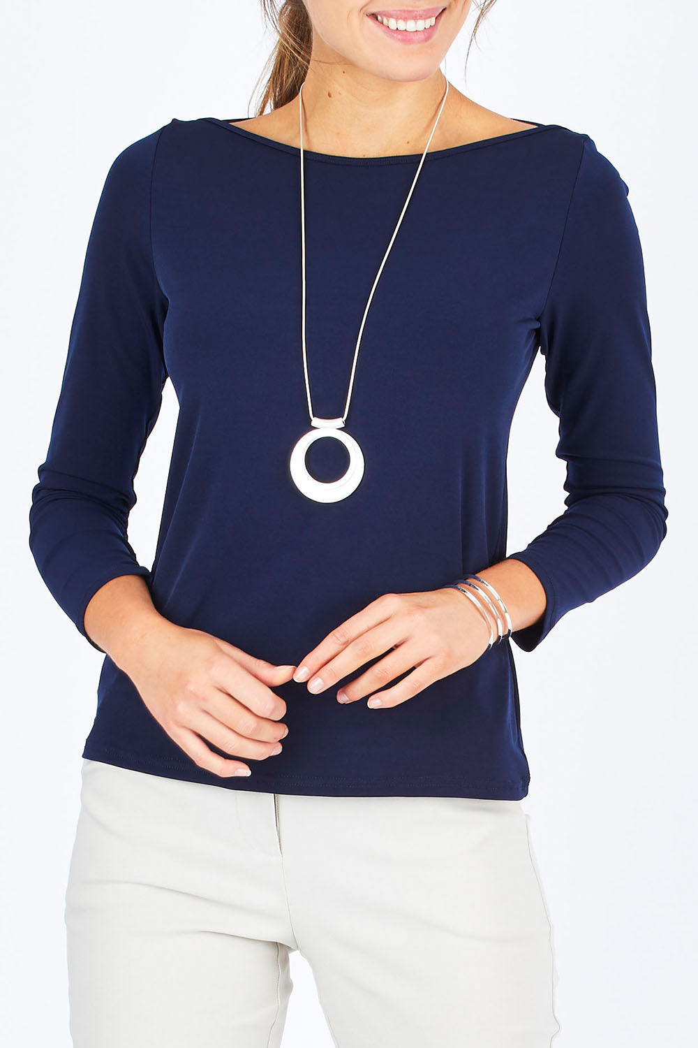 Model Madeline wearing size 10 of The Boat Neck Top in colour Navy (Blue), from the front, cropped image