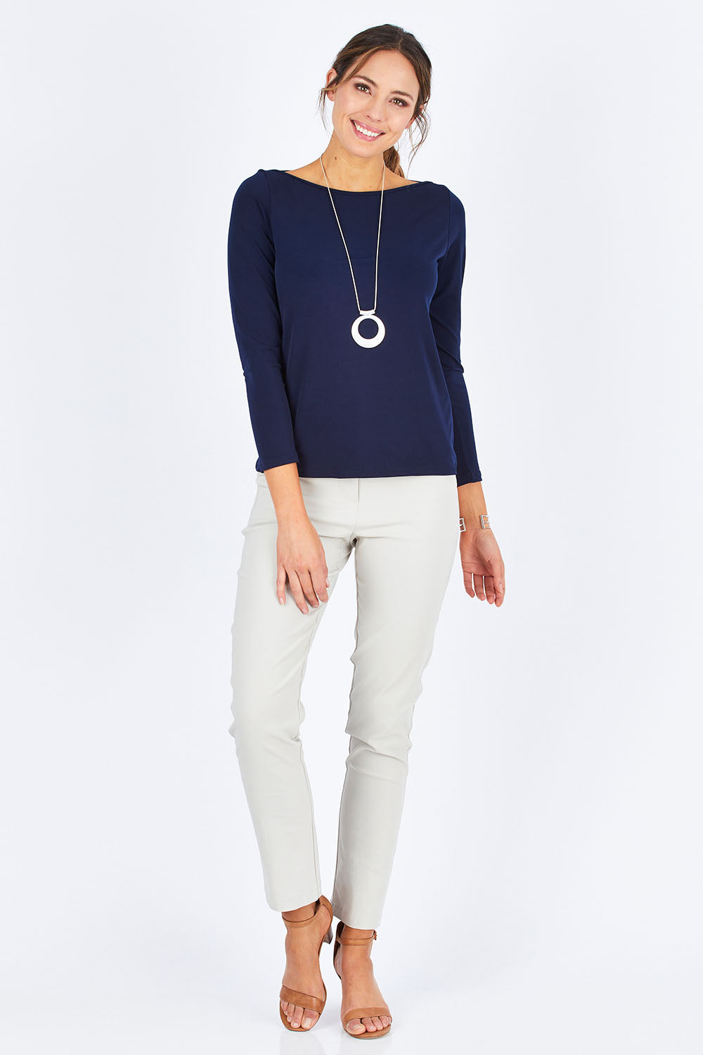 Model Madeline wearing size 10 of The Boat Neck Top in colour Navy (Blue), from the front, showing the whole outfit