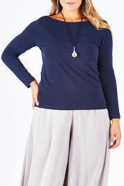Model Palatina wearing size 14 of The Boat Neck Top in colour Navy (Blue), from the front, cropped image