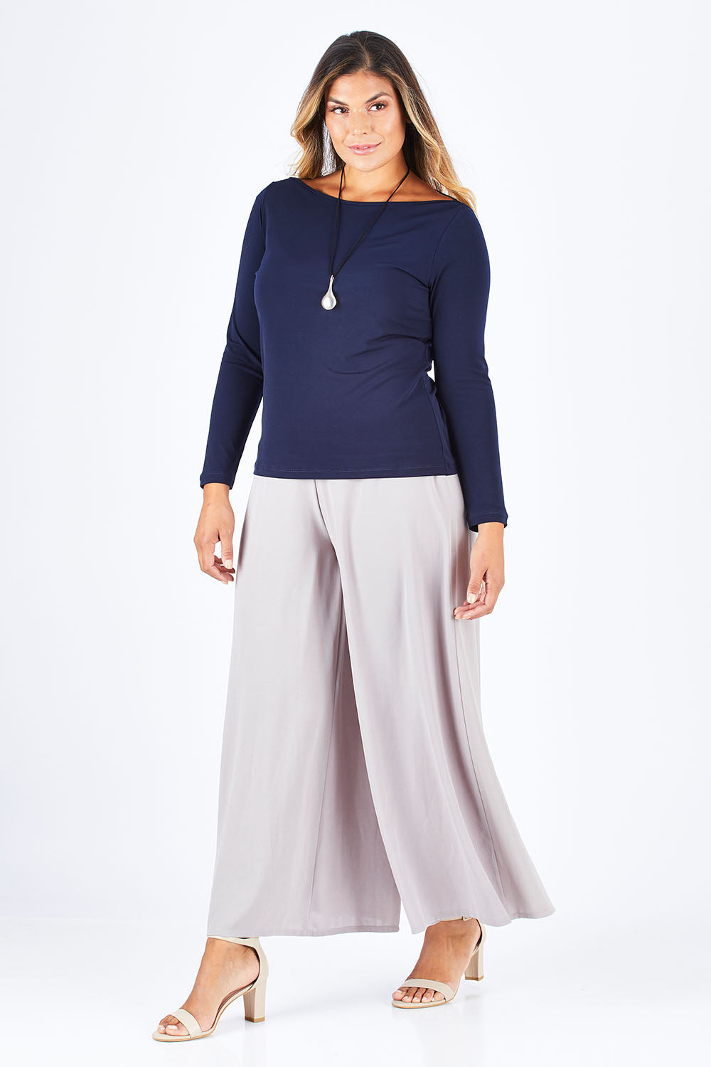 Model Palatina wearing size 14 of The Boat Neck Top in colour Navy (Blue), from the front, showing the whole outfit