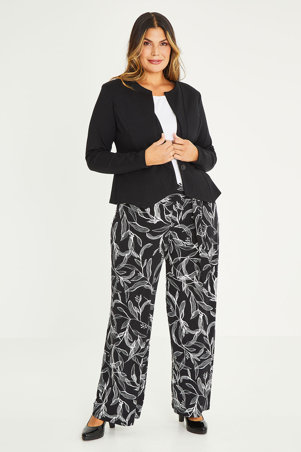 Model Palatina wearing size 16 of The Define Ponte Jacket in colour Black (Black), from the front, showing the whole outfit