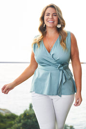 Model Fiona wearing size 16 of The Sleeveless Cotton Wrap Top in colour Sage (Green), from the front, showing the whole outfit