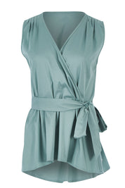 Product shot of The Sleeveless Cotton Wrap Top in colour Sage (Green), from the front