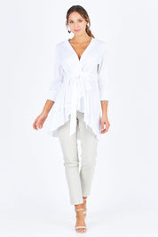 Model Madeline wearing size 10 of The Luxe Cotton Tunic in colour White (White), from the front, showing the whole outfit