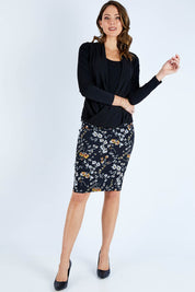 Model Madeline wearing size 10 of The Faux 2 Piece Crossover Top in colour Black (Black), from the front, showing the whole outfit