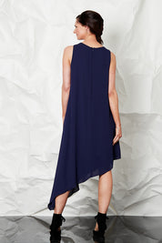 Model Anneliese wearing size 8 of the By Design in colour Slant Hem Dress - Navy (Blue), from the back