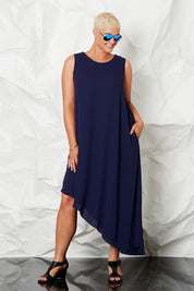 Model Stefania wearing size 14 of the By Design in colour Slant Hem Dress - Navy (Blue), from the front, showing the whole outfit