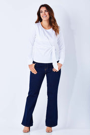 Model Laura wearing size 12 of the Knot Blouse in colour White (White), from the front, showing the whole outfit