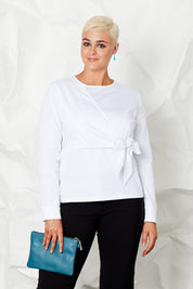 Model Rebecca wearing size 14 of the Knot Blouse in colour White (White), from the front, cropped image