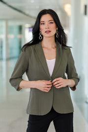 Model Miranda wearing size 10 of the Preloved The Contrast Inner Cuff Blazer in colour Khaki (Green), from the front, showing the whole outfit