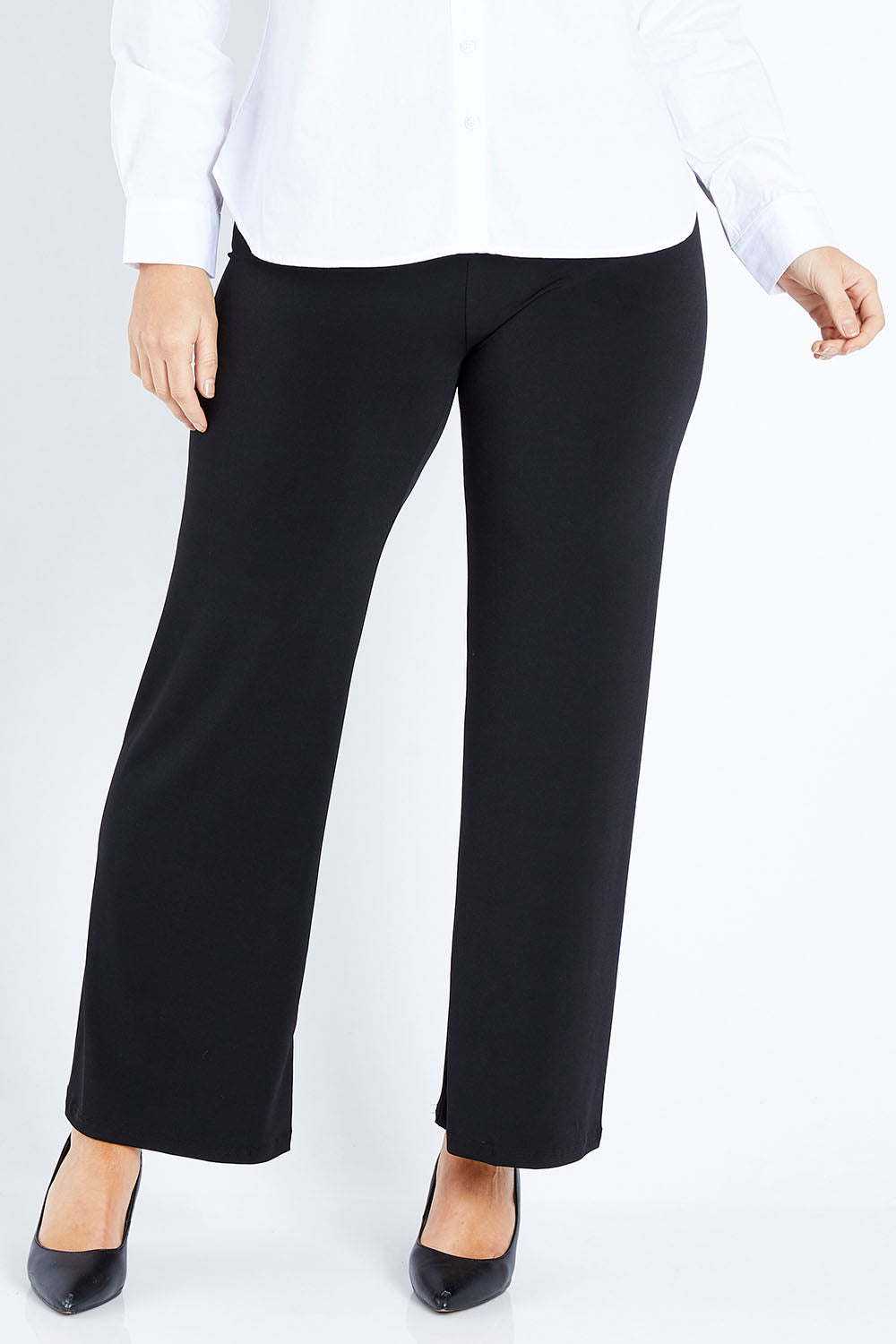 Model Laura wearing size 12 of The Wide Waistband Basic Pull On Pant in colour Black (Black), from the front, cropped image