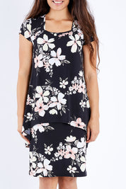 Model Larissa wearing size 10 of The Printed Short Sleeve Rita Dress in colour Pinkfleur (Black), from the front, cropped image
