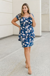 Model Fiona wearing size 16 of The Printed Short Sleeve Rita Dress in colour Floral (Blue), from the front, showing the whole outfit