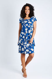 Model Pamela wearing size 10 of The Printed Short Sleeve Rita Dress in colour Floral (Blue), from the front, showing the whole outfit