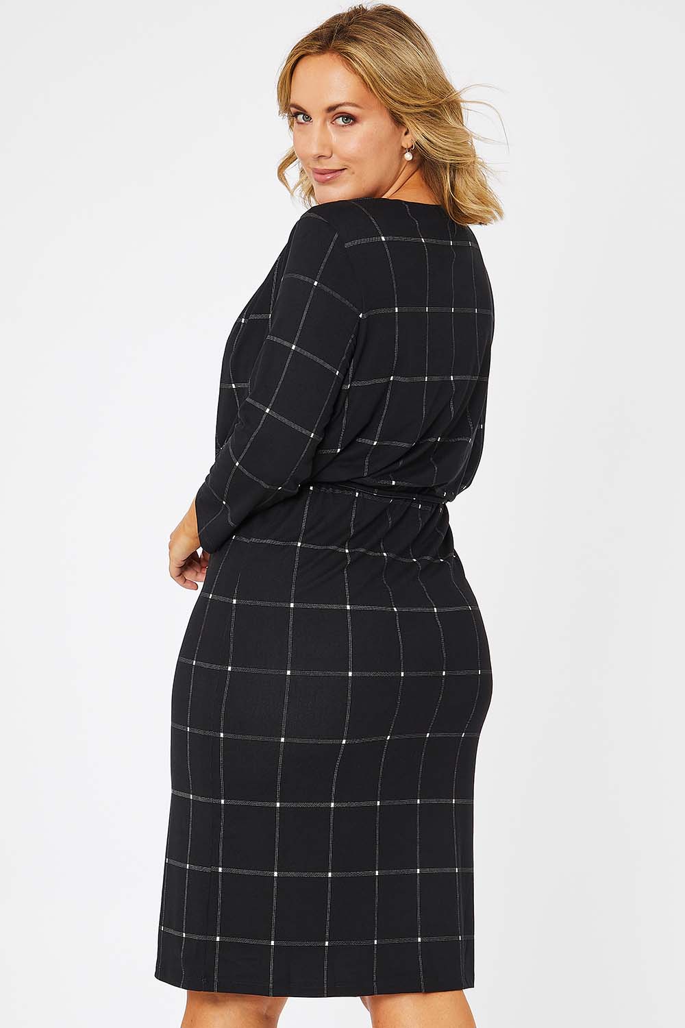 Model Jess wearing size 14 of The Lined Jersey Dress in colour Checks (Black), from the back