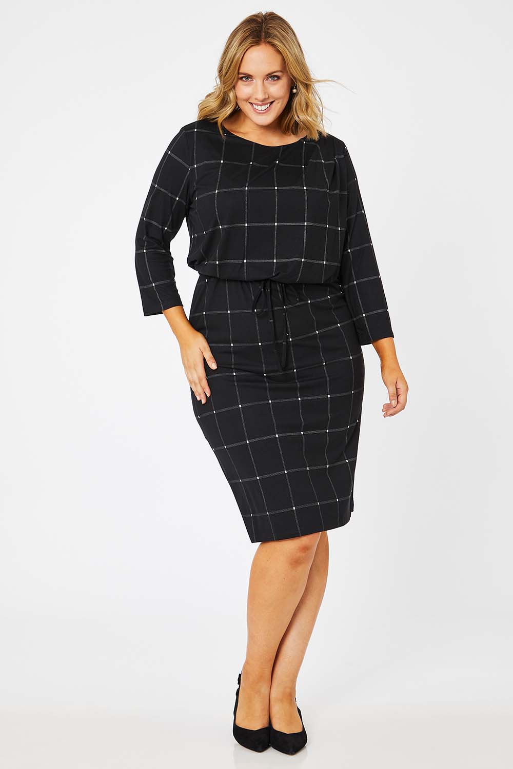 Model Jess wearing size 14 of The Lined Jersey Dress in colour Checks (Black), from the front, showing the whole outfit