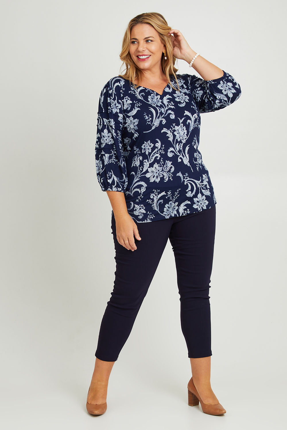 Model Fiona wearing size 16 of The Stretch Career Pull On Pant in colour Black (Black), from the front, showing the whole outfit