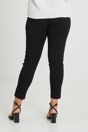Model Terri-Leigh wearing size 14 of The Stretch Career Pull On Pant in colour Black (Black), from the back