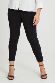 Model Terri-Leigh wearing size 14 of The Stretch Career Pull On Pant in colour Black (Black), from the front, cropped image