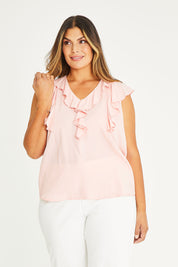 Model Palatina wearing size 16 of The Flowy Ruffle Top in colour Pink (Pink), from the front, cropped image
