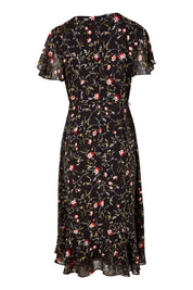 Product shot of The Printed Chiffon Lined Dress in colour Botanical (Black), from the back