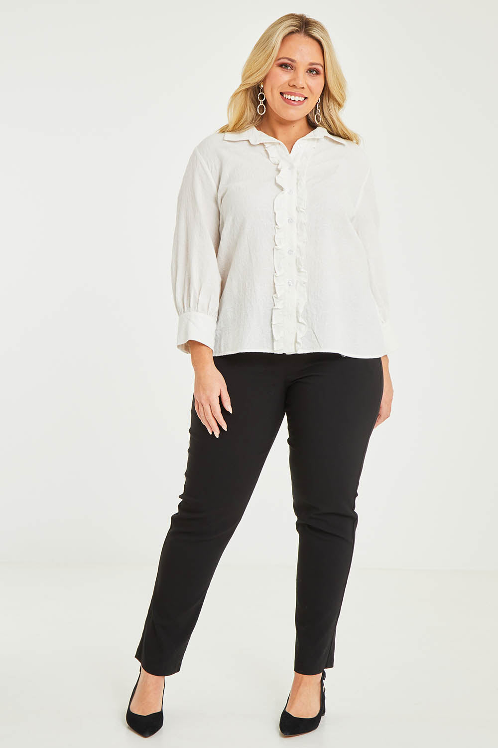 Model Katie wearing size 16 of The Frill Placket Cotton Dobby Shirt in colour White (White), from the front, showing the whole outfit