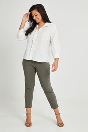 Model Terri-Leigh wearing size 14 of The Frill Placket Cotton Dobby Shirt in colour White (White), from the front, showing the whole outfit