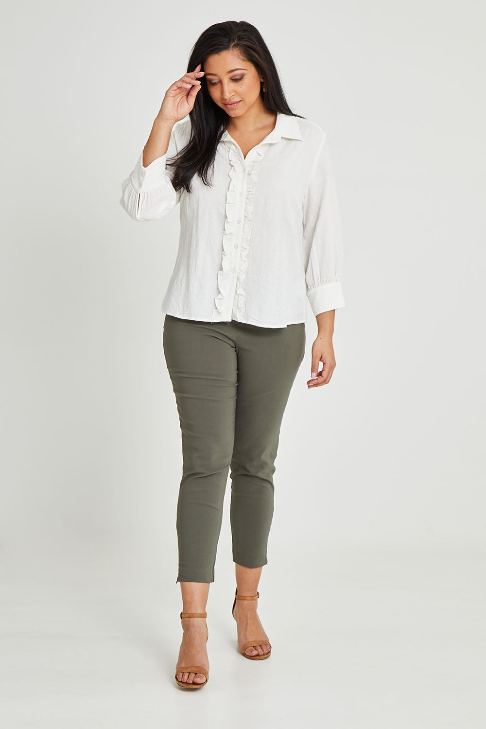Model Terri-Leigh wearing size 14 of The Frill Placket Cotton Dobby Shirt in colour White (White), from the front, showing the whole outfit