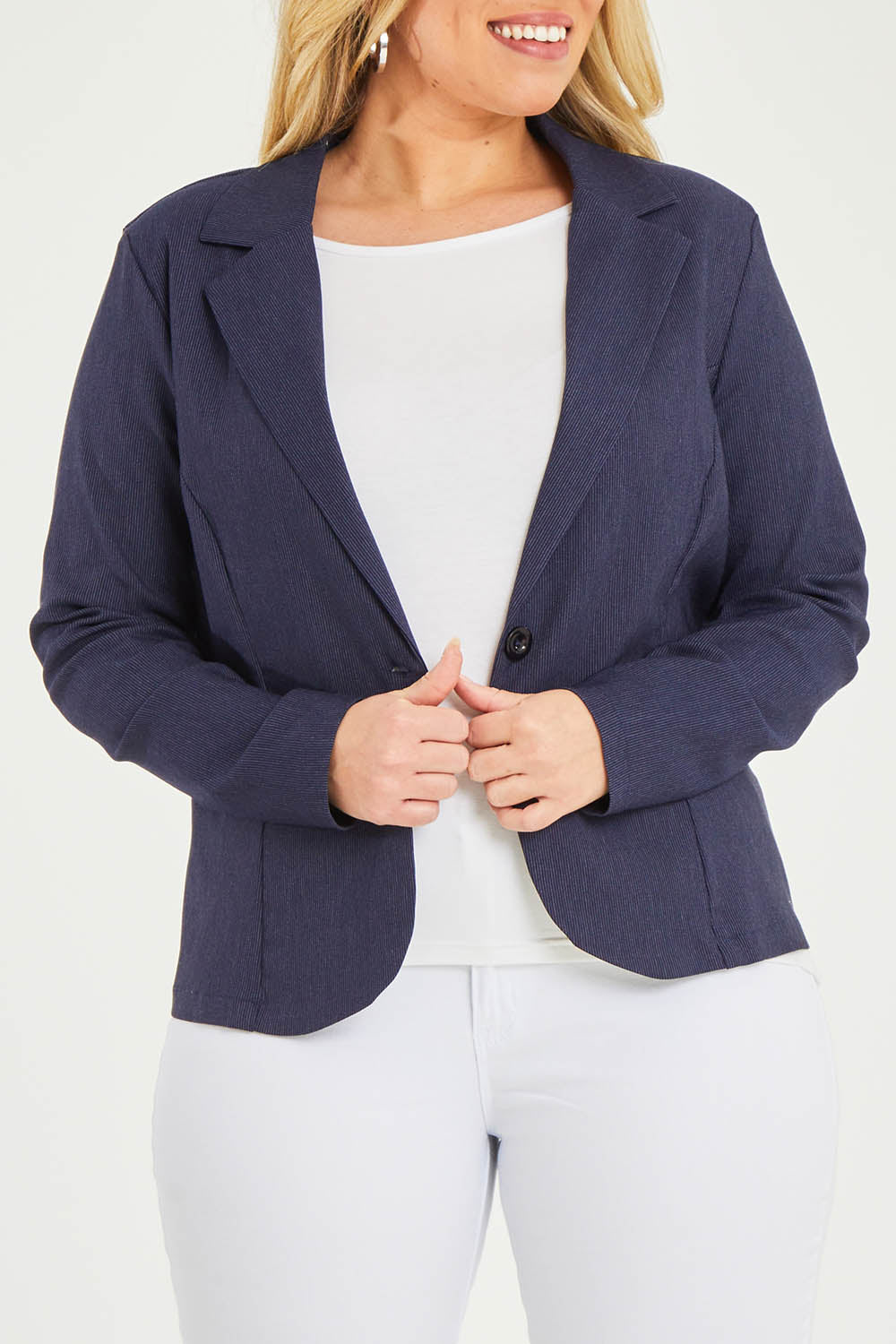 Model Katie wearing size 16 of The Stretch Classic Blazer in colour Navy (Blue), from the front, cropped image