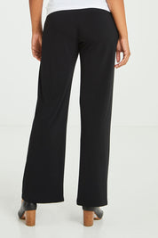Model Olivia wearing size 10 of The Essential Jersey Pull On Pant in colour Black (Black), from the back