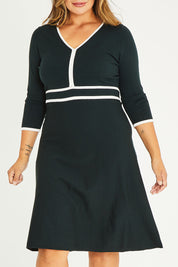 Model Palatina wearing size XL of The Contrast Trim Knit Dress in colour Darkpine (Green), from the front, cropped image