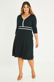 Model Palatina wearing size XL of The Contrast Trim Knit Dress in colour Darkpine (Green), from the front, showing the whole outfit