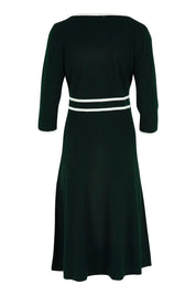 Product shot of The Contrast Trim Knit Dress in colour Darkpine (Green), from the back
