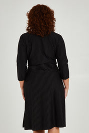 Model Maddy wearing size 16 of The Stripe Ponte Pocket Dress in colour Stripe (Black), from the back