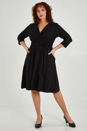 Model Maddy wearing size 16 of The Stripe Ponte Pocket Dress in colour Stripe (Black), from the front, showing the whole outfit