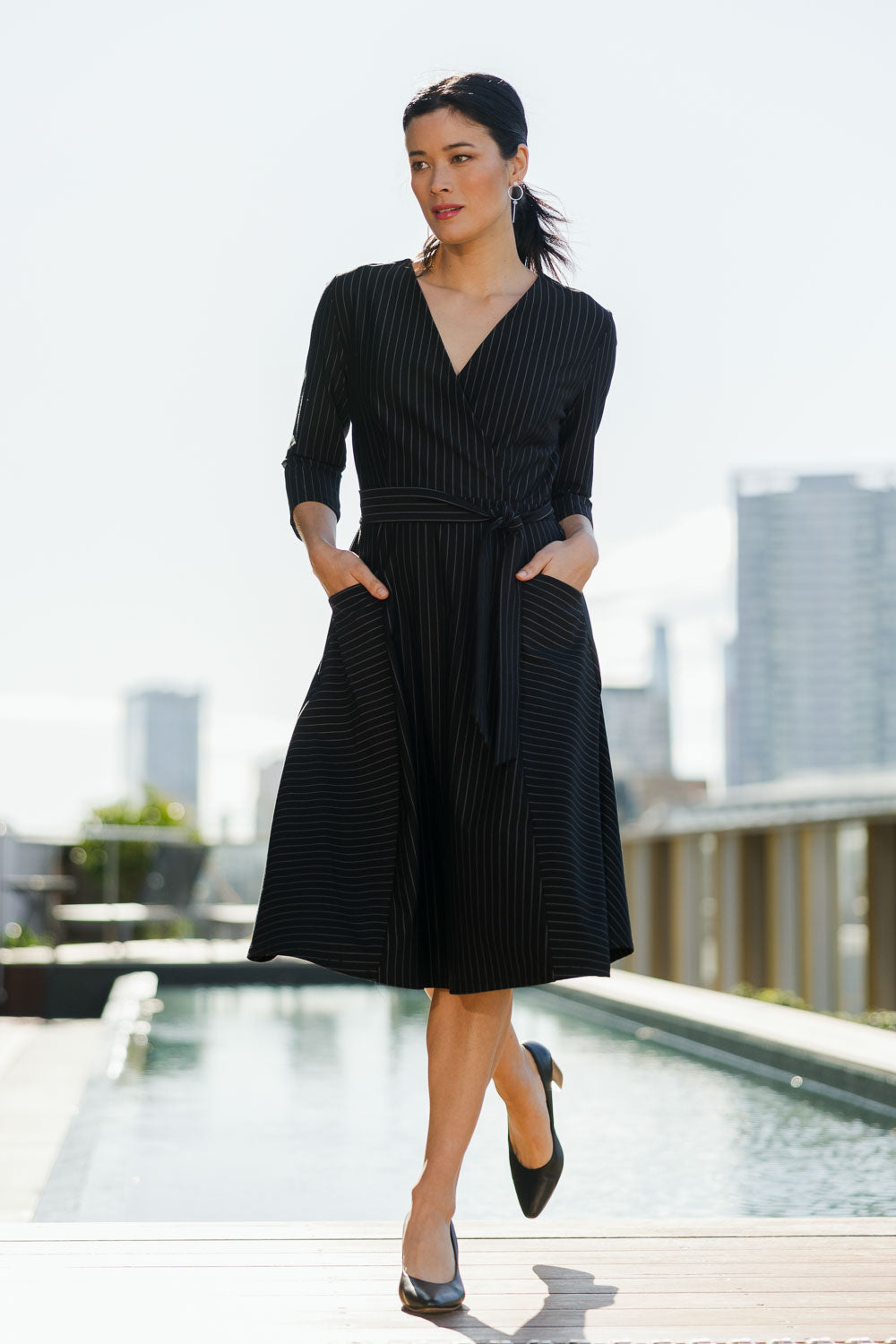 Model Miranda wearing size 10 of The Stripe Ponte Pocket Dress in colour Stripe (Black), from the front, showing the whole outfit
