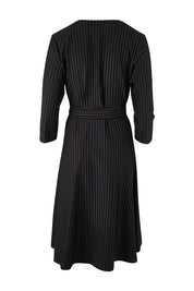 Product shot of The Stripe Ponte Pocket Dress in colour Stripe (Black), from the back