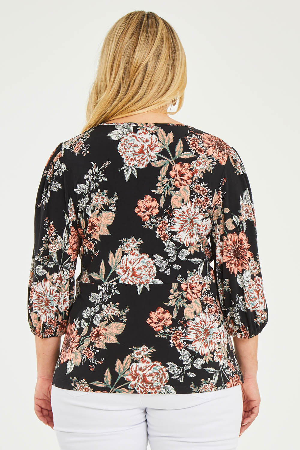 Model Katie wearing size 16 of The Knot Waist Detail Blouse in colour Blackfleur (Black), from the back