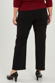 Model Maddy wearing size 16 of The Classic Tailored Stretch Pant in colour Black (Black), from the front, cropped image