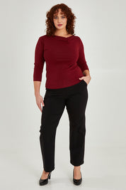 Model Maddy wearing size 16 of The Classic Tailored Stretch Pant in colour Black (Black), from the front, showing the whole outfit
